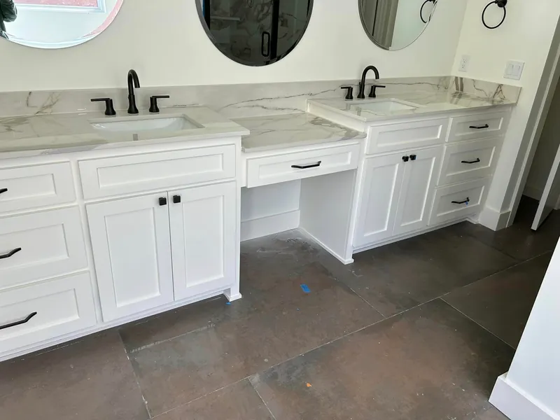 Custom white shaker cabinets with granite countertops