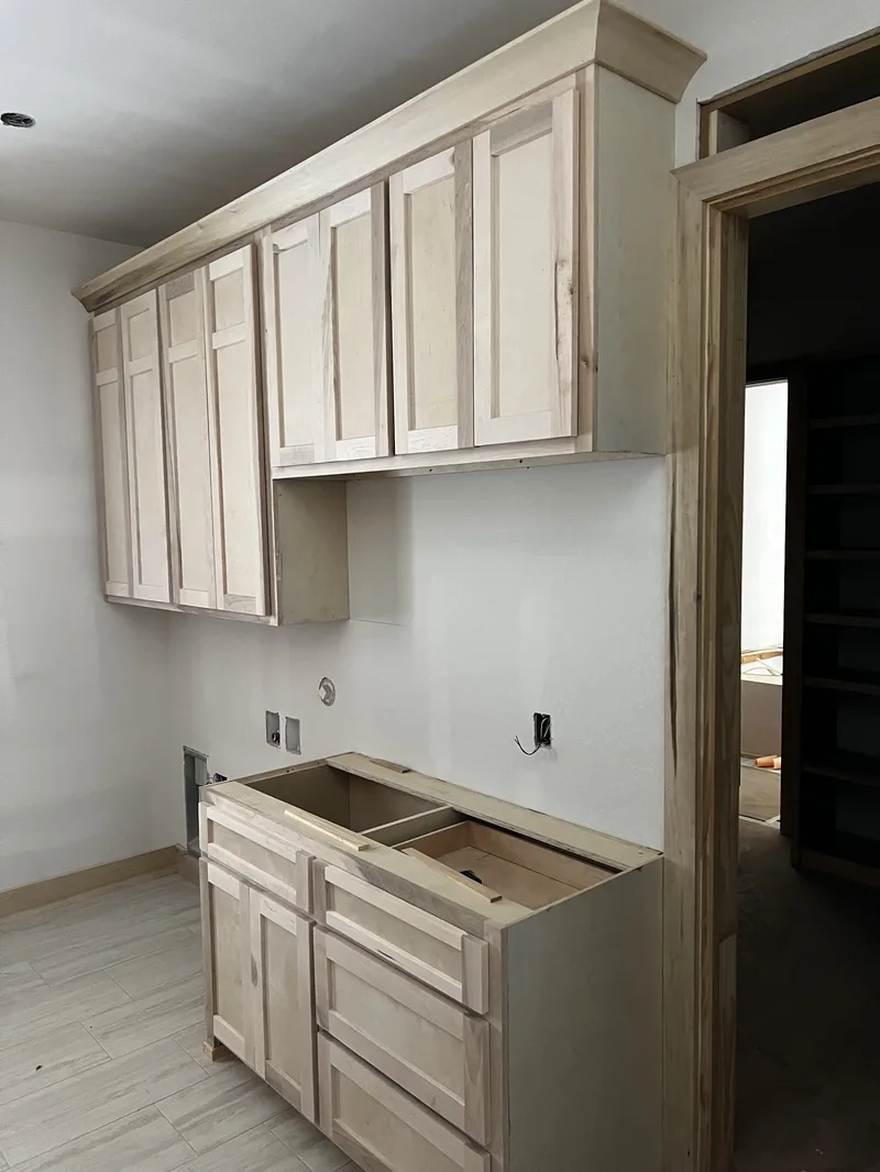 Pull-out shelf installation inside kitchen cabinets